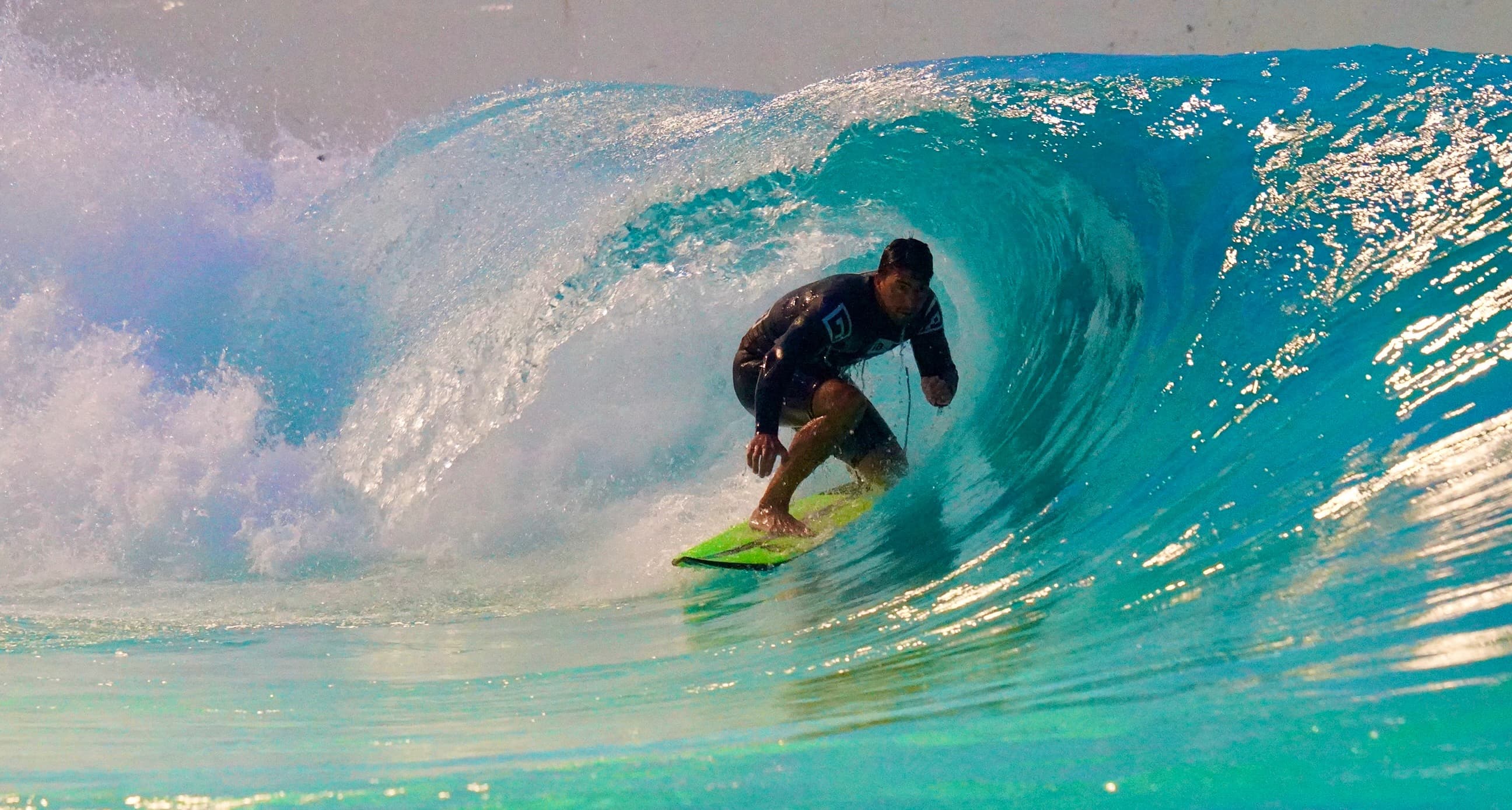 A surfer surfing on a barrel on a perfect wave 